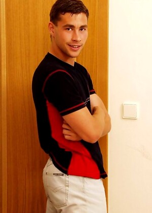 Muscled twink shows his uncut fat cock